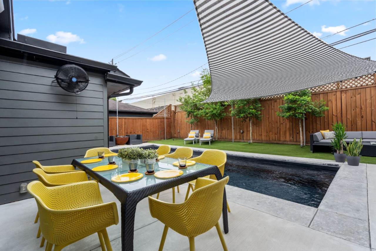 River Oaks Transformation — Covered outdoor dining with bold accent seating
