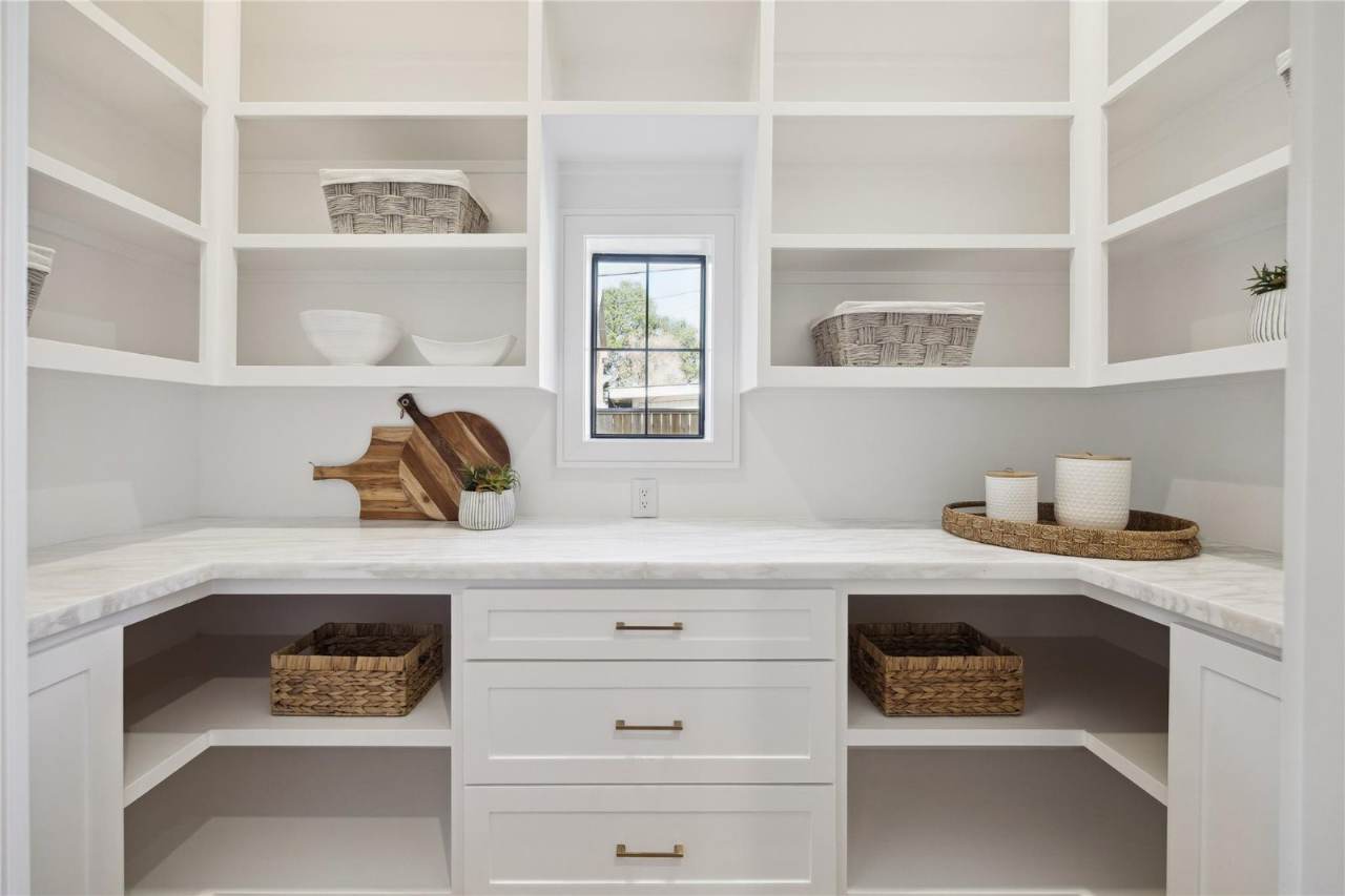 West University Custom Home — Walk-in pantry with custom shelving and natural light