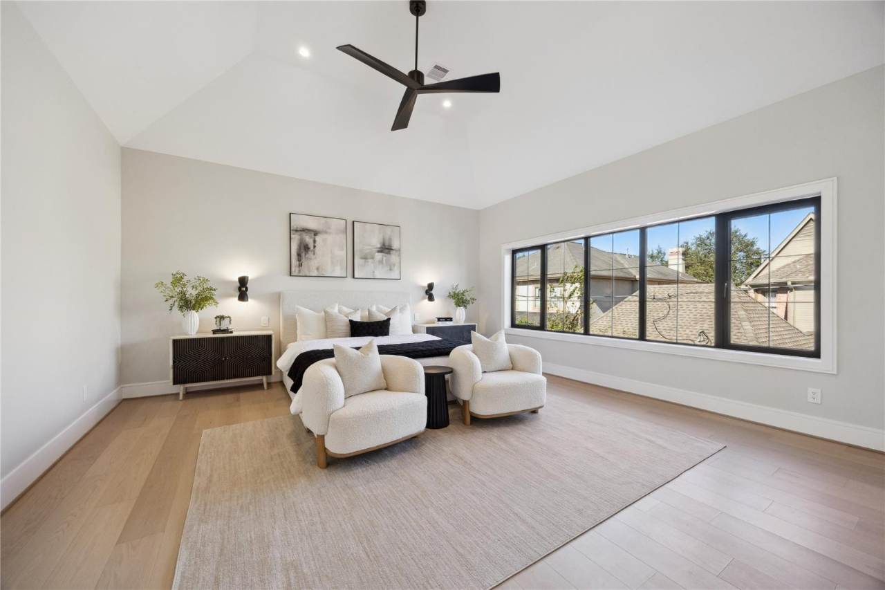 West University Custom Home — Vaulted primary suite with oversized windows